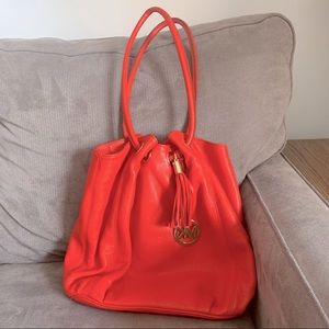 Good condition MICHAEL KORS bag. Reddish Orange color.